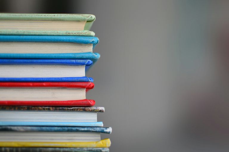 Child reading a book on a cozy couch